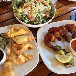 Crab Rangoon, coconut shrimp and Caesar salad Crab Rangoon, coconut shrimp and Caesar salad