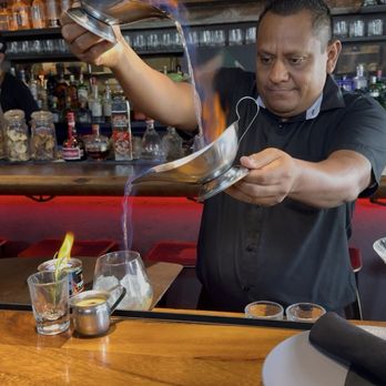 Outpost - Inez with the flambé pour up. - Mexican Near Me - Cabo San Lucas, BCS Outpost - Inez with the flambé pour up. - Mexican Near Me - Cabo San Lucas, BCS
