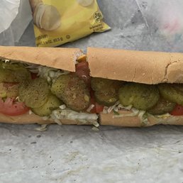 Ham sandwich with mayonnaise, American cheese, lettuce, tomatoes, pickles, salt, and pepper. Very good