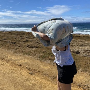 Papakolea Green Sand Beach - Using shirt as shield from wind and sand. Super comfortable! - Beaches Near Me Papakolea Green Sand Beach - Using shirt as shield from wind and sand. Super comfortable! - Beaches Near Me
