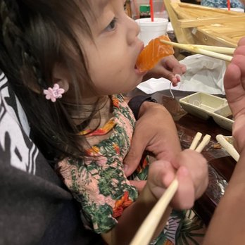Mido Sushi - my 2 year old loving the sashimi - Sushi Bars Near Me - Chandler, Arizona