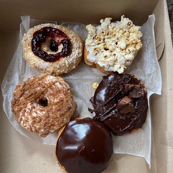 North Fork Doughnut - From Top to Bottom & Left to Right- Linzer Tart, Kettle Corn, Carmel Crumb, Chocolate Fudge Brownie, Boston Cream - Donuts Near Me - Bay Shore, New York North Fork Doughnut - From Top to Bottom & Left to Right- Linzer Tart, Kettle Corn, Carmel Crumb, Chocolate Fudge Brownie, Boston Cream - Donuts Near Me - Bay Shore, New York
