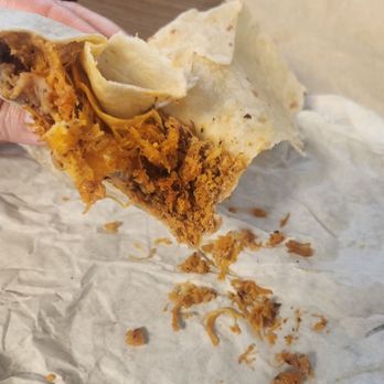 Tina's Mexican Food - Dry chicken crumbled coming out of the tortilla - Mexican Near Me - Riverside, California Tina's Mexican Food - Dry chicken crumbled coming out of the tortilla - Mexican Near Me - Riverside, California