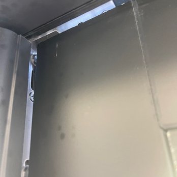Milgard Windows and Doors - this shows the interior of the door showing daylight when closed with very slight pressure from one hand - Building Supplies Near Me - Chandler, Arizona
