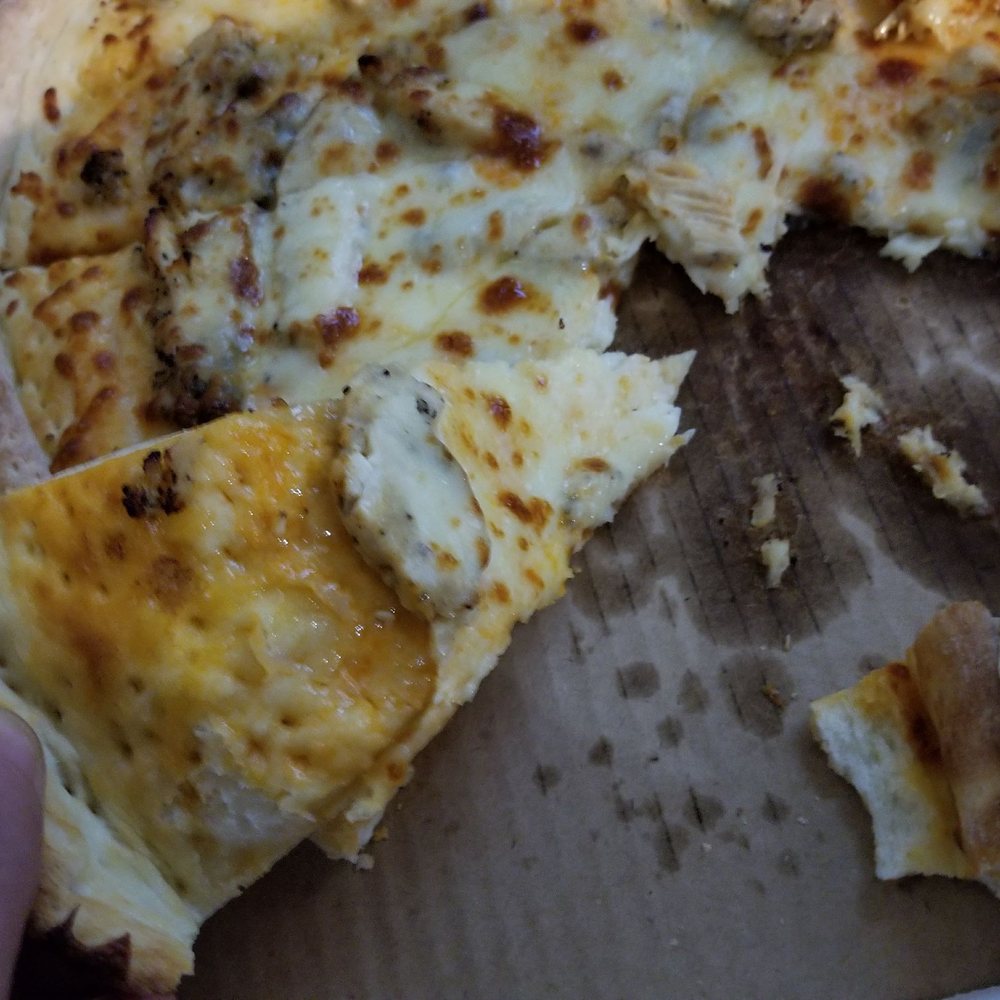 Casey's - a person taking a slice of pizza - Pizza Near Me - Altoona, Iowa Casey's - a person taking a slice of pizza - Pizza Near Me - Altoona, Iowa