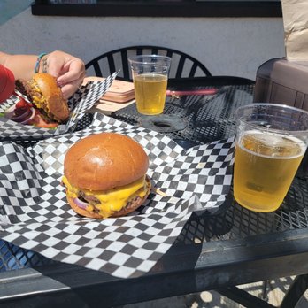 Grinderz - A double cheese burger and cold coors light. - Burgers Near Me - Huntington Beach, California Grinderz - A double cheese burger and cold coors light. - Burgers Near Me - Huntington Beach, California