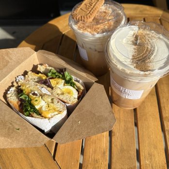 Coffee Up Roastery - Bischoff latte and Mayan Mocha latte plus a tasty breakfast bagel. - Coffee & Tea Near Me - Chino, California Coffee Up Roastery - Bischoff latte and Mayan Mocha latte plus a tasty breakfast bagel. - Coffee & Tea Near Me - Chino, California
