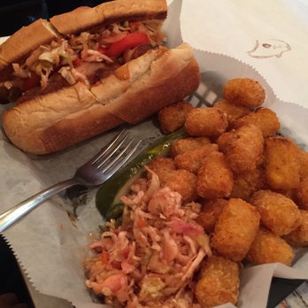 Satchmo's - Smoked chicken po boy with tater tots and coleslaw on the side. - Cajun/Creole Near Me - Flagstaff, Arizona Satchmo's - Smoked chicken po boy with tater tots and coleslaw on the side. - Cajun/Creole Near Me - Flagstaff, Arizona