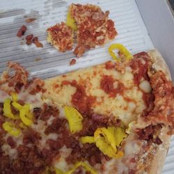 Tano's Pizza - No sauce, raw dough.