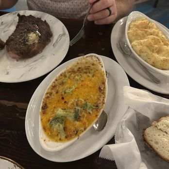 Field's Steak and Oyster Bar - Ribeye with broccoli au gratin and Parmesan potatoes - Steakhouses Near Me - Bay St. Louis, Mississippi Field's Steak and Oyster Bar - Ribeye with broccoli au gratin and Parmesan potatoes - Steakhouses Near Me - Bay St. Louis, Mississippi