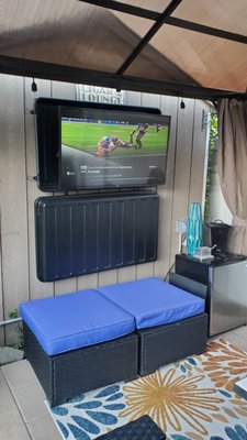 Backyard Gazebo cabling installation. - A customer requested a solution for an outdoor TV for a backyard gazebo to have cable TV. Installed a weatherproof exterior coax cable through underground PVC pipes to the shed by the gazebo and a IR remote extender from the shed to the bottom of the TV. Backyard Gazebo cabling installation. - A customer requested a solution for an outdoor TV for a backyard gazebo to have cable TV. Installed a weatherproof exterior coax cable through underground PVC pipes to the shed by the gazebo and a IR remote extender from the shed to the bottom of the TV.