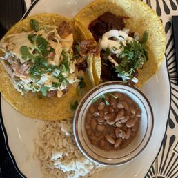 Fish taco & adobada taco with rice and pinto beans. Fish taco & adobada taco with rice and pinto beans.