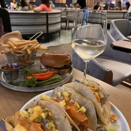 Fish tacos and burger in the background Fish tacos and burger in the background