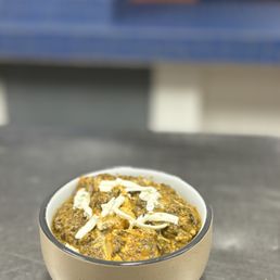 Palak paneer: Chunks of homemade cottage cheese or tofu. Cooked in a thick creamy spinach gravy seasoned with garlic, ginger Palak paneer: Chunks of homemade cottage cheese or tofu. Cooked in a thick creamy spinach gravy seasoned with garlic, ginger