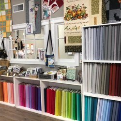 Lori's Country Cottage - A great assortment of solid fabrics among the hundreds of patterns and notions!
