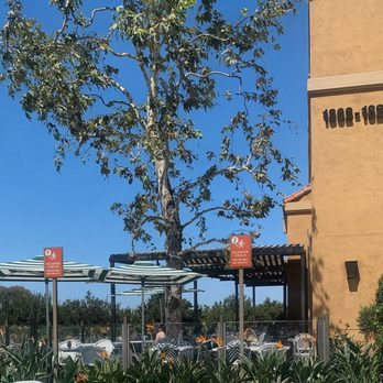 Flower Child - Outdoor patio by the entry. - New American Near Me - Newport Beach, California Flower Child - Outdoor patio by the entry. - New American Near Me - Newport Beach, California