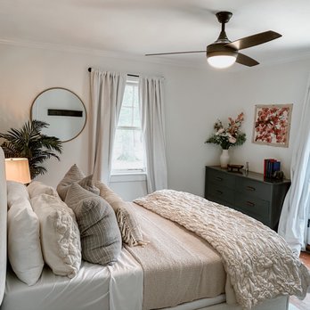 Jimenez Construction - a bedroom with a bed, dresser, and window - General Contractors Near Me - San Francisco, California