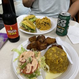 Pork Jibaritto with arroz con gandules  (rice&pigeon peas). And mogón go y carne frita (Green plantin loaf  and fried pork and salad.