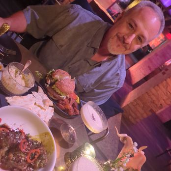 Devil May Care - Table full of goodness! - Lounges Near Me - Austin, Texas