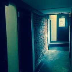 The Bull - Hallway to the toilet with really old brickwork