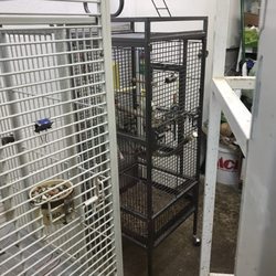 (Small birdcage with filthy bottoms)