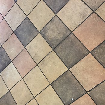Taco Bell - a tiled floor with two pairs of shoes - Fast Food Near Me - Chilliwack, British Columbia