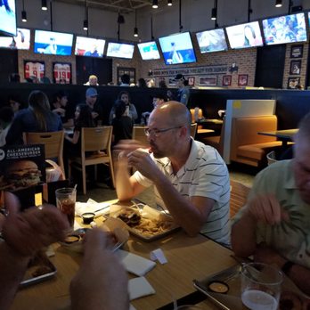 Buffalo Wild Wings - The customer enjoying this fabulous food. - Chicken Wings Near Me - Howell, Michigan