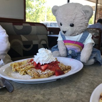 Berries - a teddy bear sitting at a table with a plate of waffles and strawberries - Coffee & Tea Near Me - Kalamazoo, Michigan