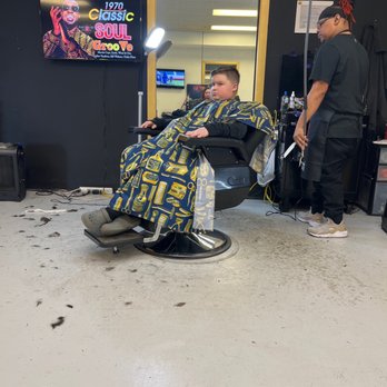 Aces Barber Shop - Darrell cutting my sons hair! Checking out his work! - Hair Salons Near Me - Des Moines, Iowa Aces Barber Shop - Darrell cutting my sons hair! Checking out his work! - Hair Salons Near Me - Des Moines, Iowa