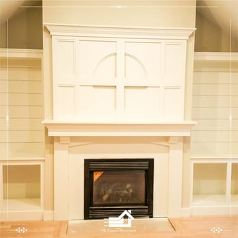 ML Custom Woodwork - arched custom mantel and custom built-in bookshelves - Interior Design Near Me - Sagamore Beach, Massachusetts