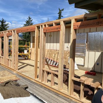 Mitchell Construction - West wall framing. 4 windows and 1 French Door. - General Contractors Near Me