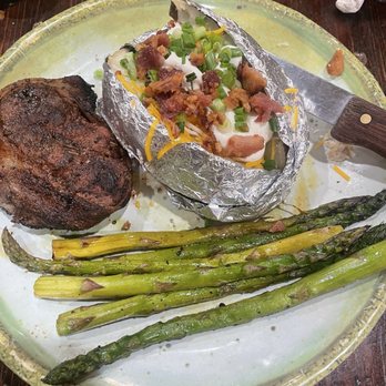 Frontier Steak & Spirits - Filet mignon with a loaded baked potato and seasoned asparagus. Yum - Steakhouses Near Me - Safford, Arizona
