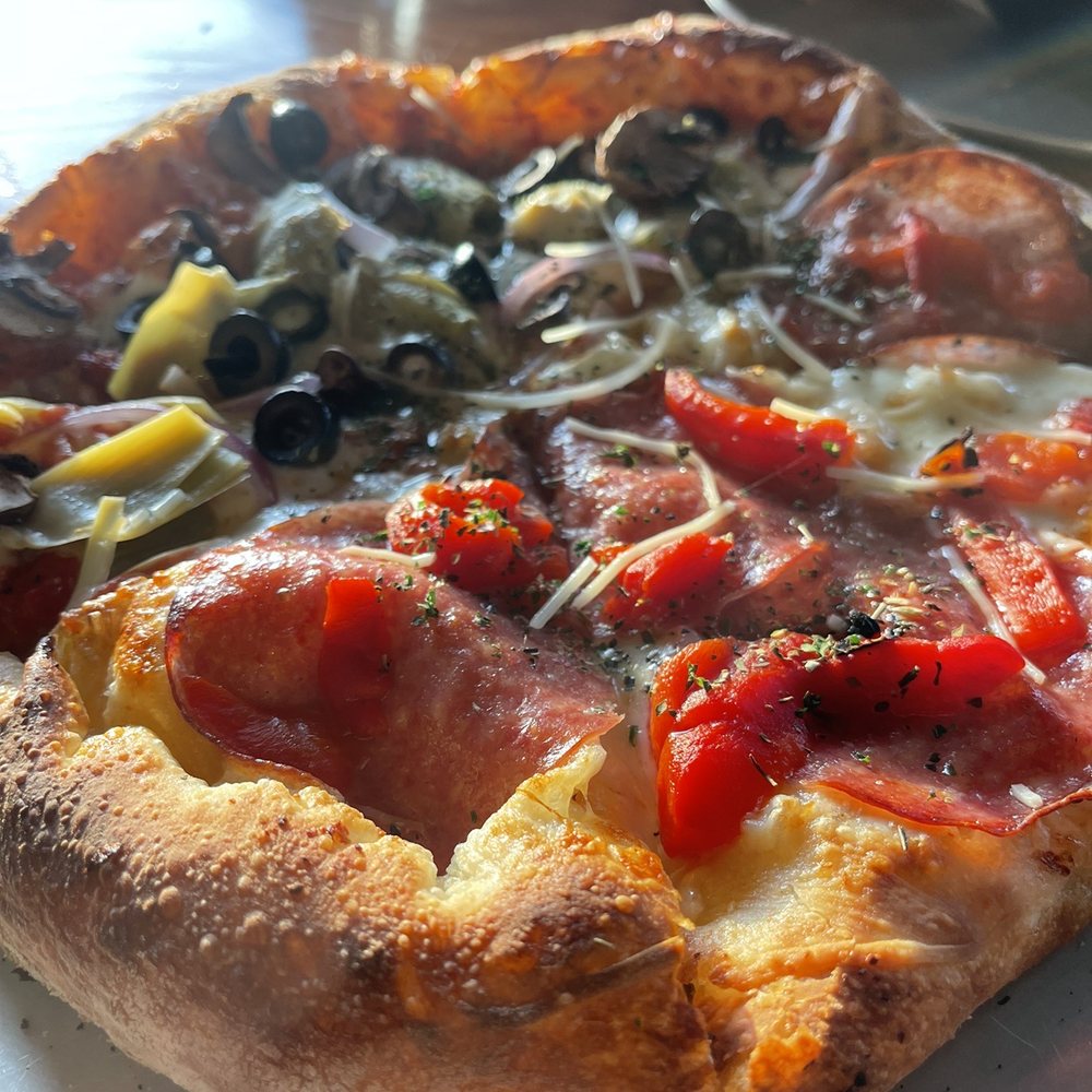 Migration Brewing - Delicious and fresh tasting wood fired pizza! Half veggie and half honey, salami and mozzarella. - Brewpubs Near Me - Gresham, Oregon Migration Brewing - Delicious and fresh tasting wood fired pizza! Half veggie and half honey, salami and mozzarella. - Brewpubs Near Me - Gresham, Oregon