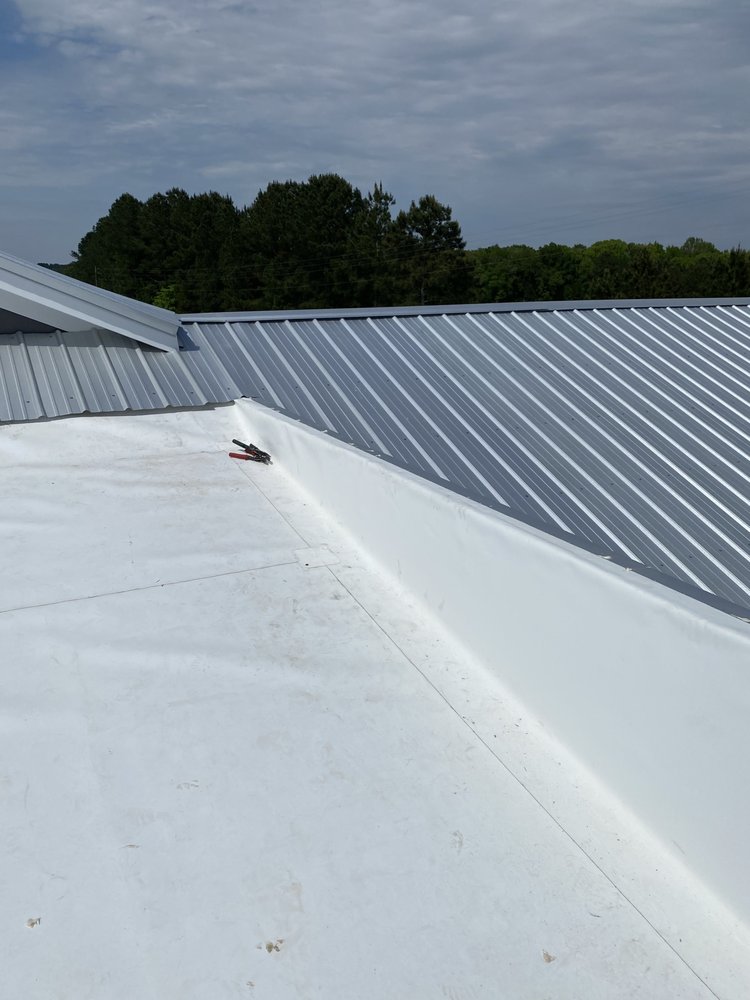 Slide of Ray’s Commercial Roofing Construction