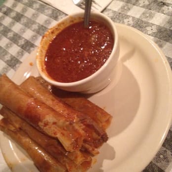Doe's Eat Place - Half dozen tamales with a cup of chili on the side. - Steakhouses Near Me - Baton Rouge, Louisiana Doe's Eat Place - Half dozen tamales with a cup of chili on the side. - Steakhouses Near Me - Baton Rouge, Louisiana
