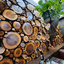Photo of Country Way - Fremont, CA, United States. Log slices on wall decor beside our table