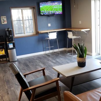 AM/PM Tire Services - Waiting area with a television and workspace on barstool area. - Tires Near Me - Hayward, California AM/PM Tire Services - Waiting area with a television and workspace on barstool area. - Tires Near Me - Hayward, California