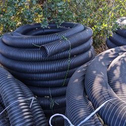 Lane Irrigation - In stock: Corrugated, flexible, 3" and 4" solid and perforated, drainage pipe with and without a sock!