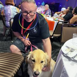 Dog Daze - My "Golden Girl" with me at a medical conference party. The very few places I can't bring her, DD has us covered.