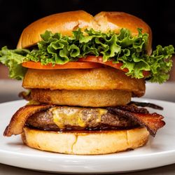 Coach's Tavern - Burger with bacon and onion rings.