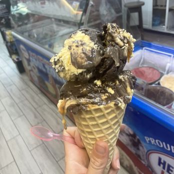 Island Sweets - a hand holding an ice cream cone - Coffee & Tea Near Me - Perdido Key, Florida