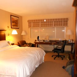 Delta Hotels Midwest City at the Reed Conference Center - Room with king sized bed, desk.