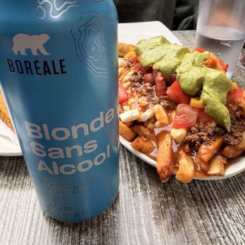 La Banquise - La Reggae poutine and non alcoholic beer - Poutineries Near Me - Montreal, Quebec