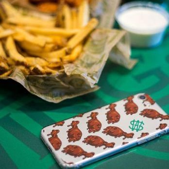 Wingstop - a burger and fries on a table - Chicken Wings Near Me - Poway, California Wingstop - a burger and fries on a table - Chicken Wings Near Me - Poway, California