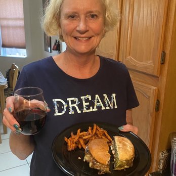 Grassburger - Lois Lane sampling both Burgrrs... Cheers!! - Burgers Near Me - Albuquerque, New Mexico