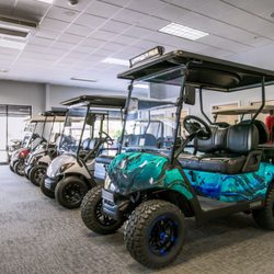 GolfCarts Unlimited - Some golf carts inside The Avenue Viera showroom.