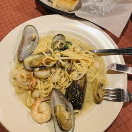 Linguine Tuttomare-clams, shrimp, scallops, and a creamy wine sauce. Linguine Tuttomare-clams, shrimp, scallops, and a creamy wine sauce.