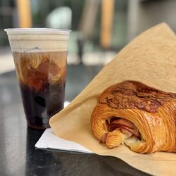 mu.sō coffee - Cold brew with lavender cold foam & turkey provolone pasty. $15