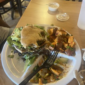 Sassool - Half eaten salmon burger - Lebanese Near Me - Raleigh, North Carolina