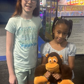 Off the Wall GameZone - My granddaughter giving another little girl a monkey she got out of the claw machine. Fun times for all. - Trampoline Parks Near Me - Davie, Florida Off the Wall GameZone - My granddaughter giving another little girl a monkey she got out of the claw machine. Fun times for all. - Trampoline Parks Near Me - Davie, Florida